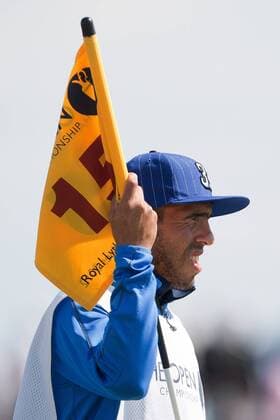 Golf - The Open - Day Four Carlos Tevez of Manchester City acts as caddie for Andres Romero of Argentina at Royal Lytham & St Anne s Golf Club 