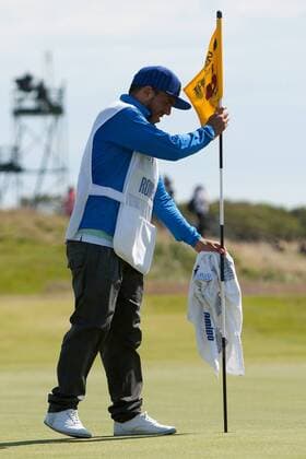 Golf - The Open - Day Four Carlos Tevez of Manchester City acts as caddie for Andres Romero of Argentina at Royal Lytham & St Anne s Golf Club 