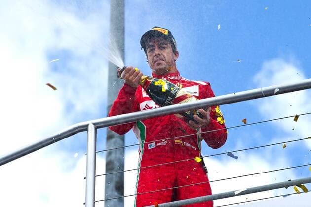 Fernando ALONSO (ESP), Scuderia Ferrari, Sieger, 1. Platz, feiert mit Champagner; Querformat; Triumph; Rennen am 22.07.2012; Halbfigur, Querformat; Motorsport Formel 1, Grosser Preis Santander von Deutschland am Hockenheimring, vom 19.07.-22.07.2012