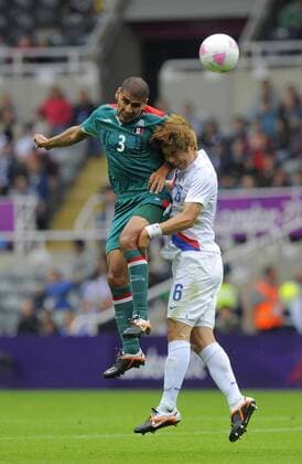 Mexico s Carlos Salcido (L) beats South Korea s Ki Sung-Yueng to the ball..London Olympic 2012 first round Group B men s match between Mexico v South Korea at the St. James Park, Newcastle upon Tyne on the 26th July 2012. Pic Richard Lee SPORTIMAGE... EDITORIAL USE ONLY. No use with unauthorised audio, video, data, fixture lists, club league logos or live services. Online in-match use limited to 120 images, no video emulation. No use in betting, games or single club league player publications.