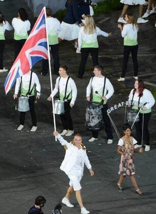 Chris Hoy of Great Britain carries the Union Jack as he leads his team in the Parade of Nations during the Opening Ceremony of the London 2012 Summer Olympics on July 27, 2012 in Stafford, London.  OLY20120727192
