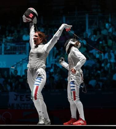Italy s Arianna Errigo (L) celebrates victory over fellow Italian Valentina Vezzali (R) in the Semi-Final of the Individual Women s Foil at the London 2012 Summer Olympics on July 28,2012 in London.  OLY20120728616