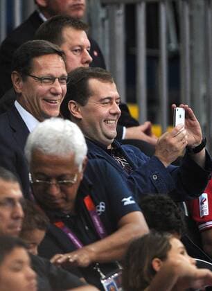 LONDON, GREAT BRITAIN. JULY 28, 2012. President of the Russian Olympic Committee (ROC), Alexander Zhukov and Russian Prime Minister Dmitry Medvedev (middle L-R) attend the women s volleyball game Russia 3 -1 Great Britain at the London 2012 Olympic Games.  premiumd RE104180