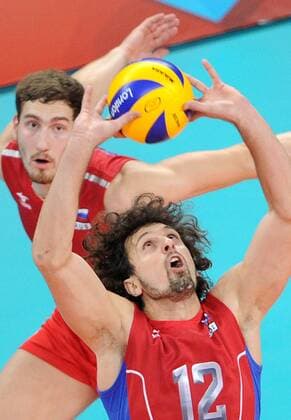 ITAR-TASS: LONDON, UK. JULY 29, 2012. Russia s Alexander Butko (front) and Maxim Mikhailov seen during a preliminary round group B men s volleyball match against Germany at London 2012 Summer Olympic Games, at Earls Court. Russia won the game 3:0.  premiumd Highlight RE1042EA