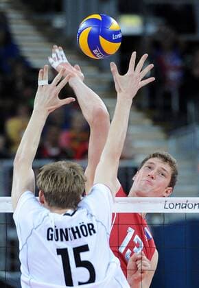 ITAR-TASS: LONDON, UK. JULY 29, 2012. Germany s Max Gunthor (front) blocks Russia s Dmitry Musersky in their preliminary round group B men s volleyball match at London 2012 Summer Olympic Games, at Earls Court. Russia won the game 3:0.  premiumd Highlight S00821A2