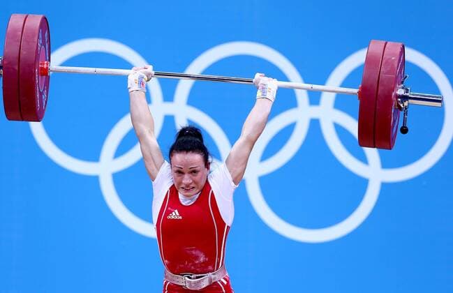 (120729) -- LONDON, July 29, 2012 (xinhua) -- Cristina Iovu of Moldova competes in women s weightlifting 53kg competition at London 2012 Olympic Games in London, Britain, on July 29, 2012. Cristina Iovu of Moldova won bronze medal. (Xinhua Chen Jianli) (nxl) (OLY2012)BRITAIN-LONDON-WEIGHTLIFTING-WOMEN S 53KG 