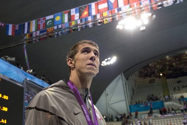 29.07.2012. London, England. The USA Mens 4 x 100m Freestyle Relay team leave the podium led by Michael Phelps (USA) after a Silver medal during the Swimming on Day 2 of the London 2012 Olympic Games at the Aquatics Centre on the Olympic Park. xRoganxThomsonx  ActionPlus11308484
