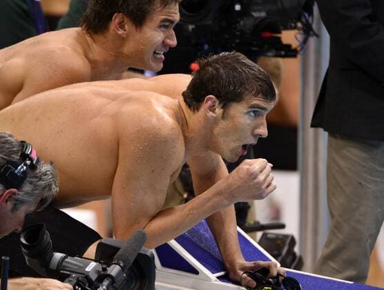 July 29, 2012 - London, GBR - Michael Phelps watches Ryan Lochte lose his lead in the final lap of the men s 4x100 Freestyle Relays at the Aquatics Center during the Summer Olympic Games in London, England, Sunday, July 29, 2012. The USA team finished second. Swimming 4x100 Relay - ZUMAm67