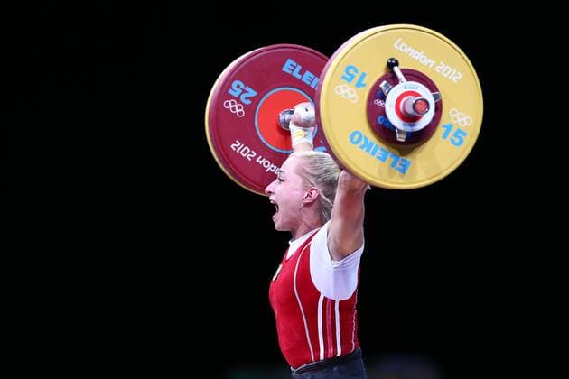 (120730) -- LONDON, July 30, 2012 (Xinhua) -- Yuliya Kalina of Ukraine competes during women s weightlifting 58kg competition, at London 2012 Olympic Games in London, Britain, on July 30, 2012. Yuliya Kalina of Ukraine won silver medal with a total weight of 236kg. (Xinhua Chen Jianli) (nxl) (OLY2012)BRITAIN-LONDON-WEIGHTLIFTING-WOMEN S 58KG 