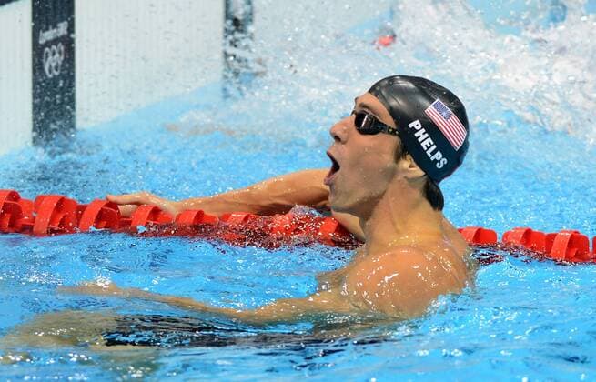 July 25, 2012 - London, GBR - USA s Michael Phelps celebrates the team s gold medal victory in the men s 4x200-meter freestyle relay, Tuesday, July 31, 2012, during the Summer Olympic Games in London, England. Men s 4x200-meter Freestyle Relay - ZUMAm67