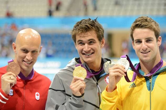 LONDON, Aug. 1, 2012 -- Gold medalist Nathan Adrian (C) of USA, silver medalist James Magnussen (R) of Australia, bronze medalist Brent Hayden of Canada pose at the awarding ceremony of men s 100m freestyle of swimming at London 2012 Olympic Games in London, Britain, on August 1, 2012. Nathan Adrian of USA won gold medal. (Xinhua Yang Zongyou) (zgp) (OLY2012)BRITAIN-LONDON-SWIMMING-men s 100M FREESTYLE-GOLD 