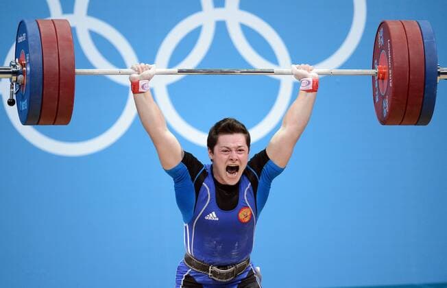 Aug. 3, 2012 - London, GBR - Natalya Zabolotnaya of Russia competes in the women s 75kg weightlifting competition the ExCeL centre during the 2012 Summer Olympic Games in London, England, Friday, August 3, 2012. Zabolotnaya won the silver medal in the event. 2012 Summer Olympics Weightlifting - ZUMAm67