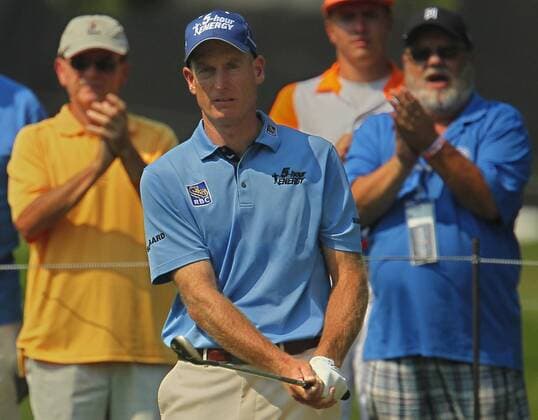 Aug. 3, 2012 - Akron, OH, USA - Members of the gallery applaud after Jim Furyk hit his third shot from the bunker on the 8th hole during second-round play at the 2012 WGC-Bridgestone Invitational at Firestone Country Club on Friday, August 3, 2012, in Akron, Ohio. 2012 WGC-Bridgestone Invitational - ZUMAm67