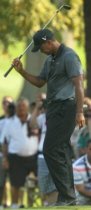 Aug. 3, 2012 - Akron, OH, USA - Tiger Woods reacts to a poor shot on the 10th hole during second-round play at the 2012 WGC-Bridgestone Invitational at Firestone Country Club on Friday, August 3, 2012, in Akron, Ohio. 2012 WGC-Bridgestone Invitational - ZUMAm67