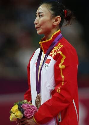 LONDON, Aug. 4, 2012 - Silver medalist Huang Shanshan of China attends awarding ceremony of women s trampoline competition at the London 2012 Olympic Games in London, Britain, Aug. 4, 2012. 