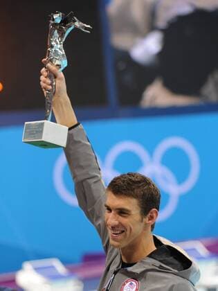 Michael Phelps (USA) holds a special Olympic recognition trophy after he won his 18th gold in the Men s 4x100 Medley Relay Final at the Aquatics Center during the London 2012 Summer Olympics in Stratford, London on August 4, 2012. Phelps won his record 18th gold and 22nd Olympic Medals to end his Olympic career.  OLY20120804124