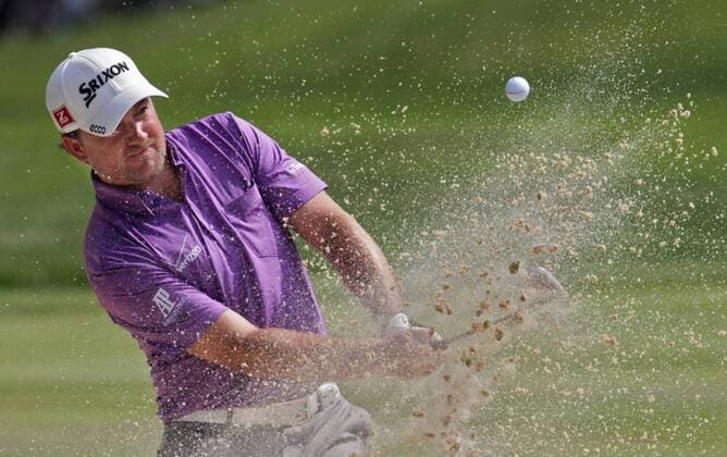 Aug. 4, 2012 - Akron, OH, USA - Graeme McDowell follows his bunker shot on the 15th hole during the third round of the Bridgestone Invitational at Firestone Country Club on Saturday, August 4, 2012, in Akron, Ohio. Bridgestone Invitational - ZUMAm67