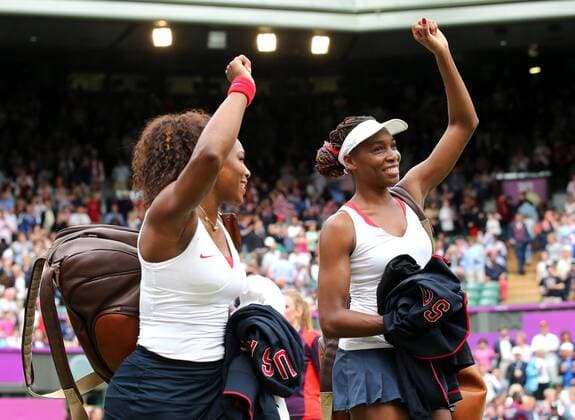 LONDON, Aug. 5, 2012 - Venus and Serena Williams celebrate after winning in women s tennis doubles match, at London 2012 Olympic Games in London, Britain, on August 5, 2012. 
