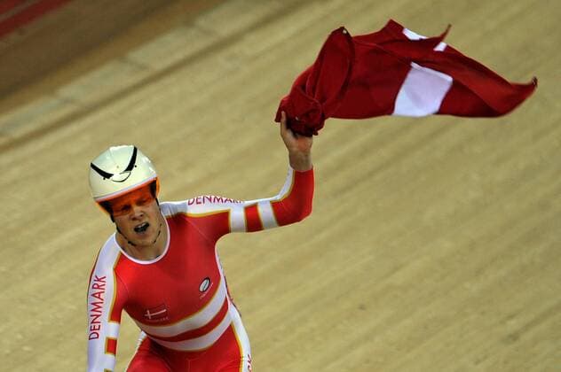 LONDON, Aug. 5, 2012 - Lasse Norman Hansen of Denmark celebrates after winning the men s omnium match of Cycling Track at London 2012 Olympic Games, London, Britain, Aug. 5, 2012. Lasse Norman Hansen won the gold of the event. 