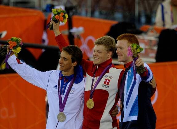 LONDON, Aug. 5, 2012 - Gold medalist Lasse Norman Hansen of Denmark (C), silver medalist Bryan Coquard of France (L), and brone medalist Edward Clancy of Britain celebrate at the awarding ceremony of men s omnium match of Cycling Track at London 2012 Olympic Games, London, Britain, Aug. 5, 2012. 