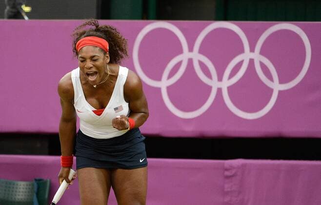 Serena Williams of the United States reacts as she plays during the Women s Doubles Gold Medal tennis match at the London 2012 Summer Olympics on August 5, 2012 in Wimbledon, London.  OLY20120805451