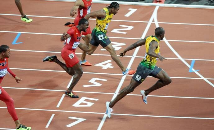 London Olympics 2012 : Mens 100m Final Usain Bolt - Jamaica crosses the line to win the race ahead of Team mate, Yohan Blake, Justin Gatlin and Tyson Gay - USA 