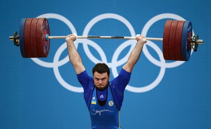 LONDON, Aug. 6, 2012 -- Oleksiy Torokhtiy of Ukraine competes during men s weightlifting 105kg final contest, at London 2012 Olympic Games in London, Britain, on August 6, 2012. Oleksiy Torokhtiy of Ukraine won goldmedal. (Xinhua Tao Xiyi) (nxl) (OLY2012)BRITAIN-LONDON-WEIGHTLIFTING-MEN S 105KG 