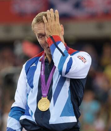 Great Britain s Chris Hoy celebrates in the victory ceremony of the Men s Keirin event at the Velodrome at the London 2012 Summer Olympics on August 7, 2012 in London.  OLY20120807608