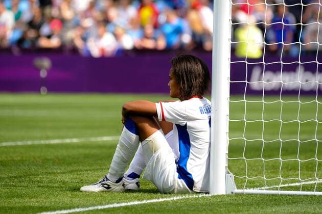 09.08.2012 Coventry, England. Wendie RENARD (France) sits forlorn after Rhian WILKINSON (Canada) scored the winning goal during the Olympic Football Women s Bronze match play-off game between France and Canada from the City of Coventry Stadium xAnthonyxStanleyx  ActionPlus11314549