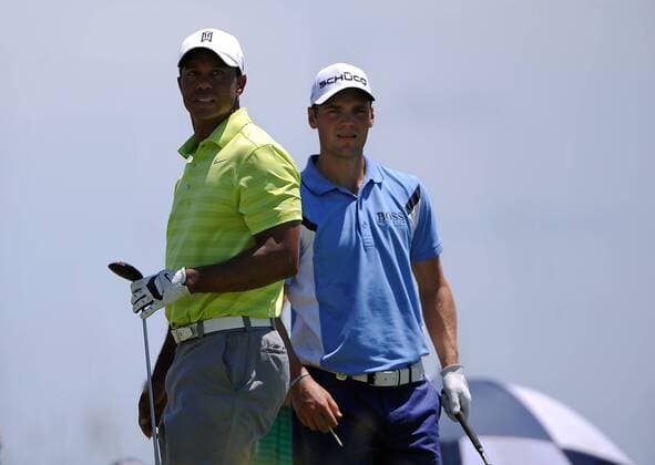 Tiger Woods, left, watches his drive on hole nine with playing partner Martin Kaymer of Germany during the first round of the PGA Golf Herren Championship on August 9, 2012 at the Ocean Course in Kiawah Island, South, Carolina.  SCP20120809126