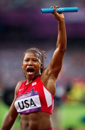London, GBR - Lauryn Williams of the United States acknowledged the cheers of the crowd following the USA s 4 X 100m relay during heat 1 of the event at Olympic Stadium during the 2012 Summer Olympic Games in London, England, Thursday, August 9, 2012. The United States team qualified by finishing first in a time of 41.64. 2012 Summer Olympics Women s Relay - ZUMAm67