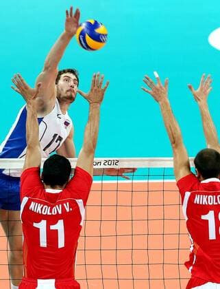 LONDON, Aug. 10, 2012 - Maxim Mikhaylov (back) of Russia smashes during men s volleyball semifinal between Russia and Bulgaria at London 2012 Olympic Games, London, Britain, Aug. 10, 2012. Russia won the match 3-1. (OLY2012)BRITAIN-LONDON-MEN S VOLLEYBALL-SEMIFINAL 