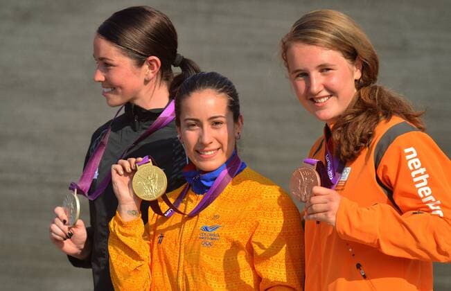 LONDON, Aug. 10, 2012 - Gold medalist Mariana Pajon of Colombia (C), silver medalist Sarah Walker of New Zealand (L) and bronze medalist Laura Smulders of the Netherlands attend victory ceremony of women s cycling BMX competition, at London 2012 Olympic Games in London, Britain, on August 10, 2012. (OLY2012)BRITAIN-LONDON-CYCLING BMX-WOMEN S BMX 