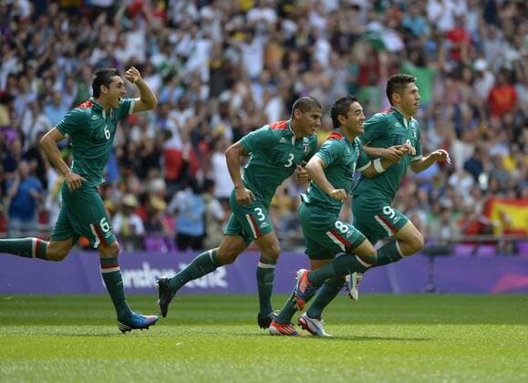 Hector Herrera, Carlos Salcido, Marco Fabian and Oribe Peralta of Mexico celebrate Peralta s goal during the first half of the Gold Medal Football Match against Brazil at the London 2012 Summer Olympics on August 11, 2012 at Wembley Stadium, London.  OLY20120811401