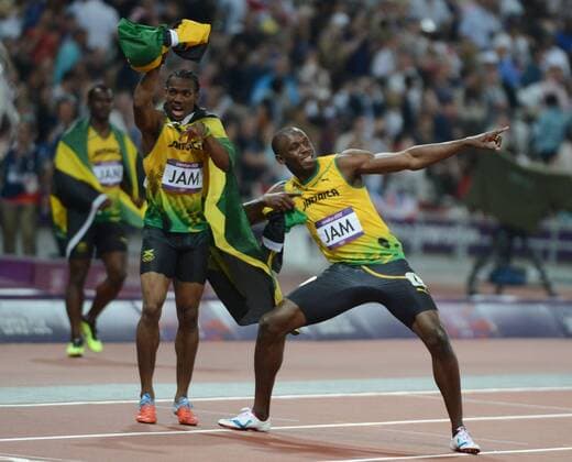 Usain Bolt of Jamaica (R) and the team celebrates winning gold in the Men s 4 x 100M relay at the London 2012 Summer Olympics on August 11, 2012 in London. The Jamaican team won with a world record of 36.84 seconds.  OLY20120811207