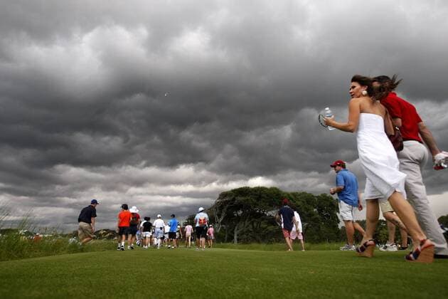 Aug. 11, 2012 - Kiawah Island, SC, USA - Golf fans head for cover after a weather warning forces a delay in play during the third round of the 2012 PGA Golf Herren Championship at the Ocean Course on Kiawah Island, South Carolina, on Saturday, August 11, 2012. PGA Golf Herren Championship, 3rd round - ZUMAm67