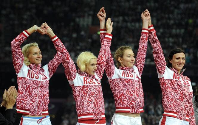 Silver medalists Russia s Yulia Gushchina, Antonina Krivoshapka, Tatyana Firova and Natalya Antyukh (L-R) pose on the podium during the medal ceremony for the Women s 4x400m Staffel Relay at the London 2012 Olympic Games.  RE105AE6