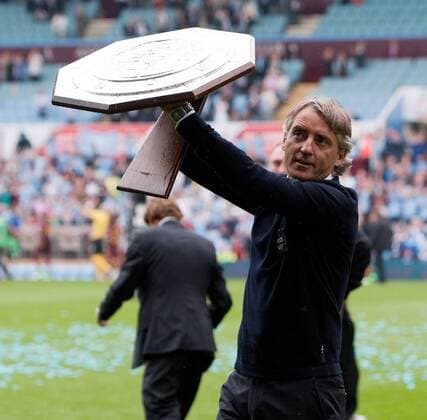 Football - FA Community Shield - Chelsea FC London vs. Manchester City; Roberto Mancini, manager of Manchester City celebrates with the shield at Villa Park 