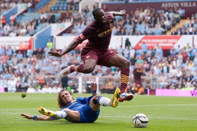 Football - FA Community Shield - Chelsea FC London vs. Manchester City; David Luiz of Chelsea challenges Yaya Toure of Manchester City at Villa Park 