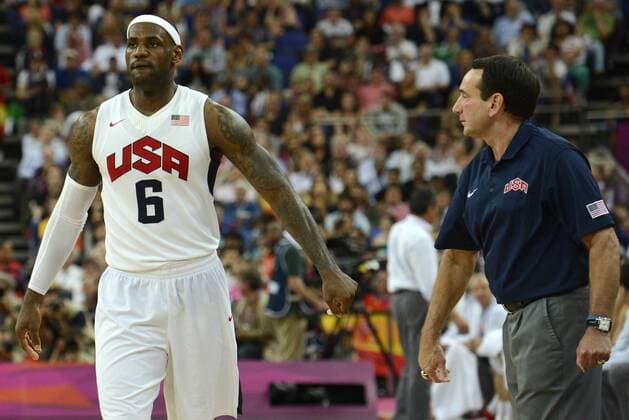 United States head coach Mike Krzyzewski (R) welcomes Lebron James off the court near the conclusion of the US gold medal win over Spain, 107-100 at the 2012 Summer Olympics, August 12, 2012, in London, England.  OLY20120812520