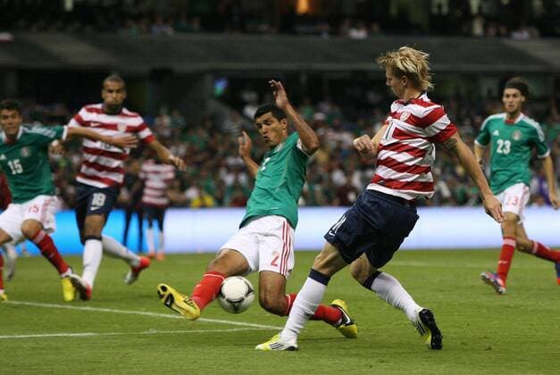 15 August 2012: Brek Shea (USA) (11) crosses through the legs of Fransisco (Maza) Javier Rodriguez (MEX) (2) towards Terrence Boyd (USA) (18) leading to the U.S. goal. The United States Men s National Team defeated the Mexico Men s National Team 1-0 at Estadio Azteca in Mexico City, Mexico in an international friendly soccer match. SOCCER: AUG 15 Mexico v USA Icon918120815007 EDITORIAL USE ONLY