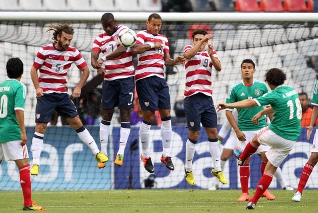 15 August 2012: Andres Guardado (MEX) (18) has his shot blocked by a wall of Kyle Beckerman (USA) (5), Maurice Edu (USA) (7), Jermaine Jones (USA) (13), and Herculez Gomez (USA) (9). The United States Men s National Team defeated the Mexico Men s National Team 1-0 at Estadio Azteca in Mexico City, Mexico in an international friendly soccer match. SOCCER: AUG 15 Mexico v USA Icon918120815011 EDITORIAL USE ONLY