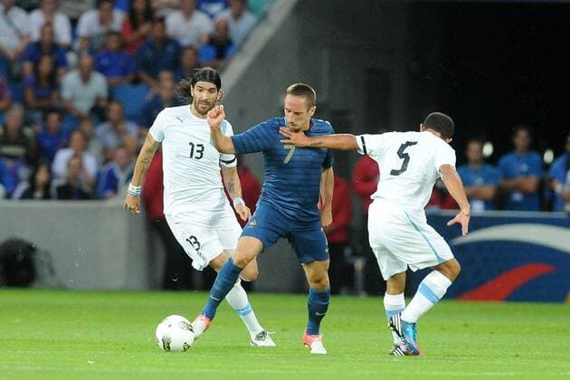 Franck Ribery (France) Sebastian Abreu - Walter Gargano (Uruguay) FOOTBALL : France vs Uruguay - Match amical - 15 08 2012 N.LeGouic FEP Panoramic 