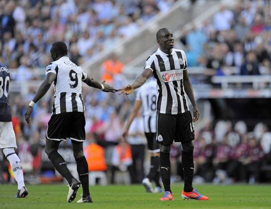 Newcastle United s Demba Ba (R) with strike partner Newcastle United s Papiss Cisse ..Barclays Premier League match between Newcastle United v Tottenham Hotspur at the Sports Direct Arena, Newcastle upon Tyne on the 18th August 2012. EDITORIAL USE ONLY. No use with unauthorised audio, video, data, fixture lists, club league logos or live services. Online in-match use limited to 120 images, no video emulation. No use in betting, games or single club league player publications.