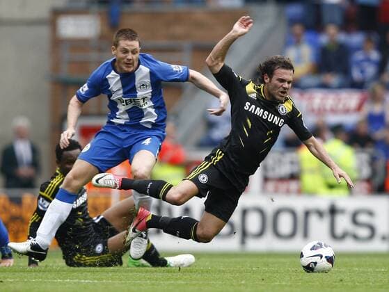 Football- Premier League. Wigan Athletic - Chelsea FC London; Wigan s James McCarthy fouls Chelsea s Juan Mata at The DW Stadium 