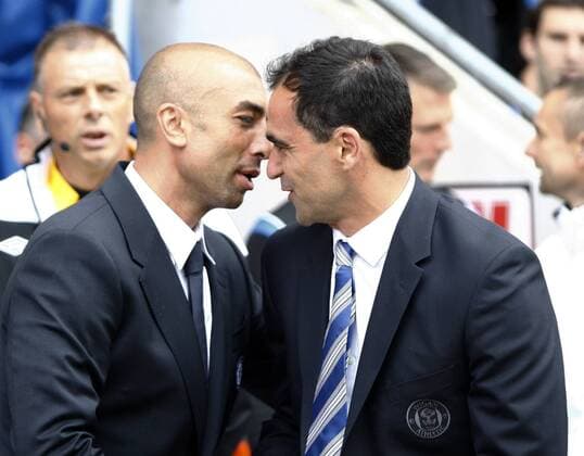 Football- Premier League. Wigan Athletic - Chelsea FC London; Chelsea manager Robert Di Matteo and Wigan manager Roberto Martinez embrace before the match at The DW Stadium 