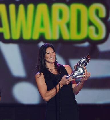 The U.S. women s soccer team goalie Hope Solo accepts her trophy after being selected the Athlete winner, beating out Cristiano Ronaldo, LeBron James, Tim Tebow and Serena Williams, during the Do Something Awards at Barker Hangar in Santa Monica, California on August 19, 2012.  LAP2012081926