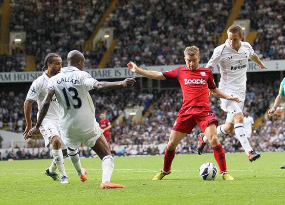 WBAs James Morrison tussles with William Gallas...Barclays Premier League, Tottenham Hotspur v West Bromwich Albion at White Hart Lane, London on the 25th August 2012. EDITORIAL USE ONLY. No use with unauthorised audio, video, data, fixture lists, club league logos or live services. Online in-match use limited to 120 images, no video emulation. No use in betting, games or single club league player publications.