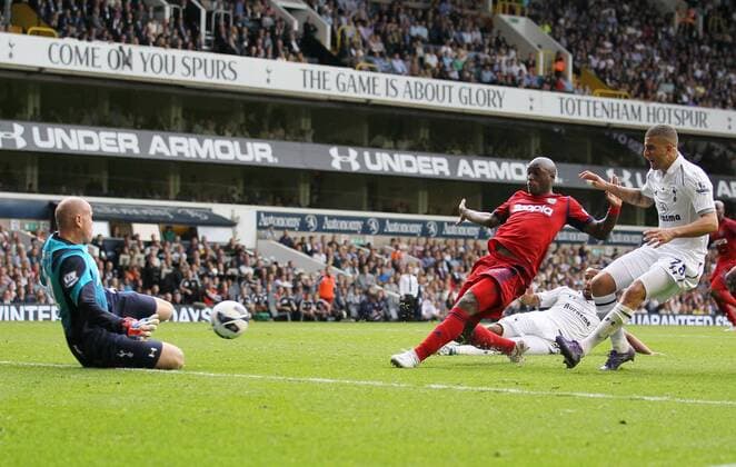 WBAs Marc-Antoine Fortune sees his shot saved by Tottenhams Brad Friedel...Barclays Premier League, Tottenham Hotspur v West Bromwich Albion at White Hart Lane, London on the 25th August 2012. EDITORIAL USE ONLY. No use with unauthorised audio, video, data, fixture lists, club league logos or live services. Online in-match use limited to 120 images, no video emulation. No use in betting, games or single club league player publications.