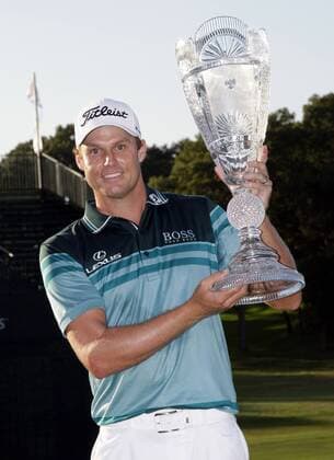 Nick Watney holds up the Championship Trophy after the final round of The Barclays 2012 FedExCup Playoffs at The Black Course at Bethpage State Park in Farmingdale, New York on August 26, 2012. Watney wins with a score of 10 under par.  NYP20120826124
